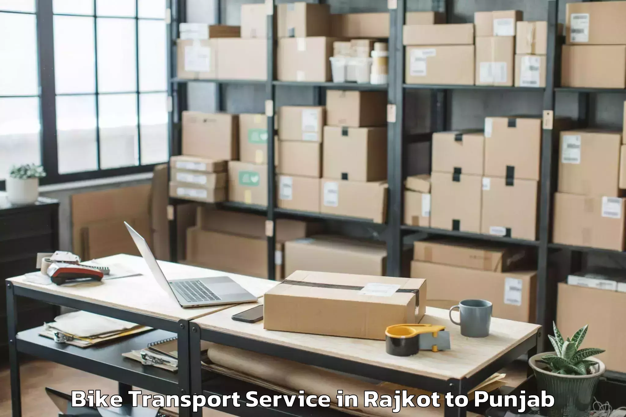 Top Rajkot to Abhilashi University Bathinda Bike Transport Available